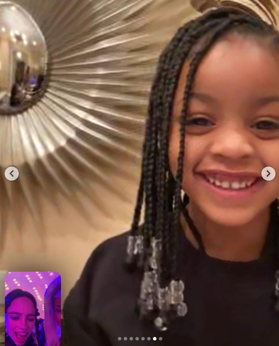 Kulture FaceTiming Billie and Cardi, who are inside the Met. Kulture is smiling as Billie speaks to her