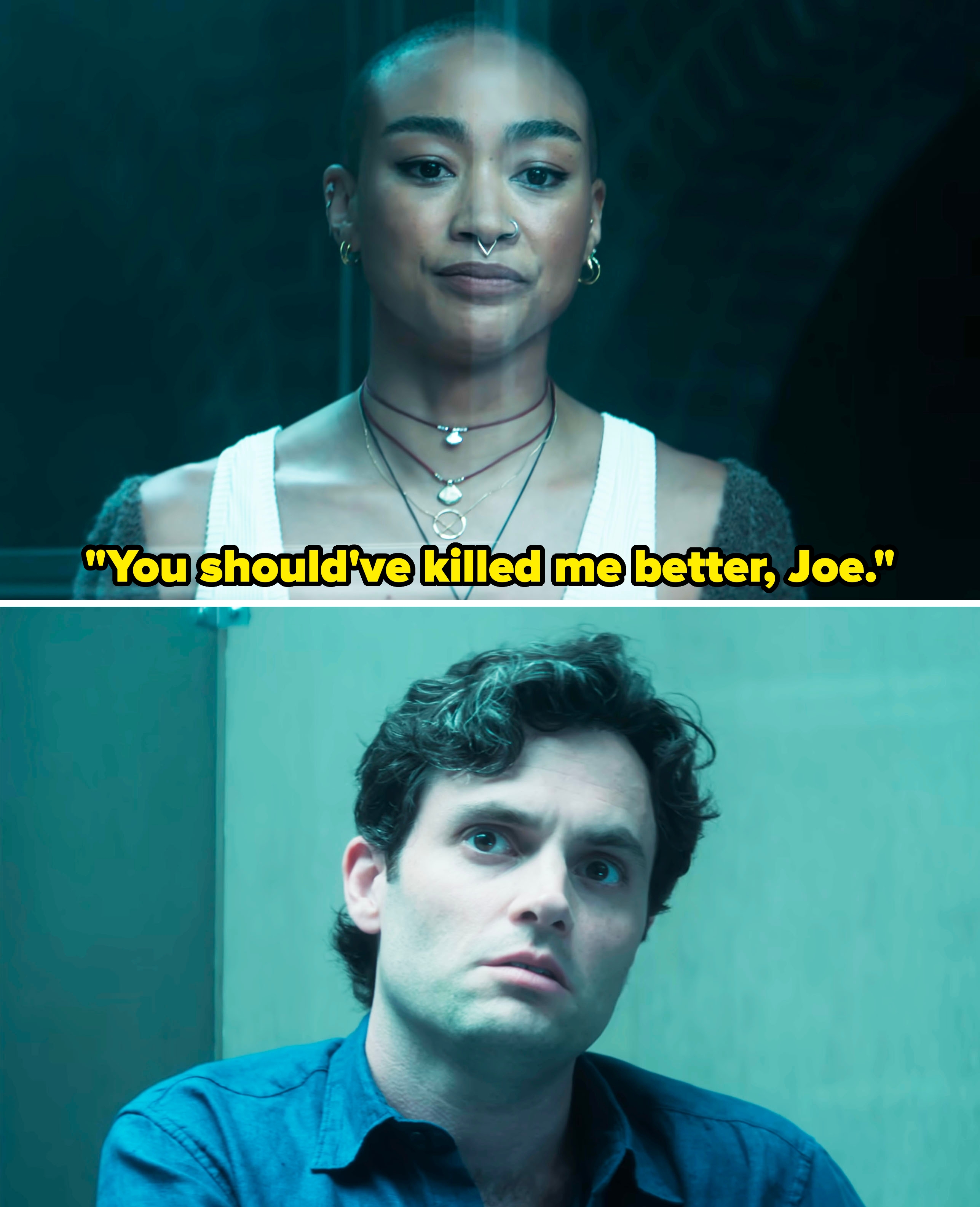 Two individuals from a TV series: a person with shaved head and layered necklaces, and a person with curly hair and a blue shirt, both appear serious