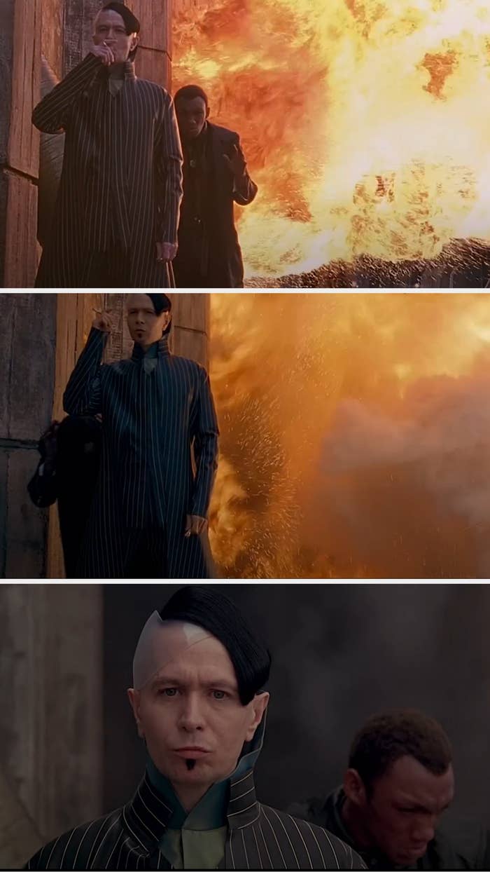 explosion behind Tricky and Gary Oldman's characters; Tricky reacts in shock, while Oldman is unconcerned