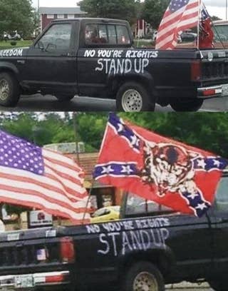A truck displays multiple flags, including an American flag, with "No you're rights, stand up" painted on its side