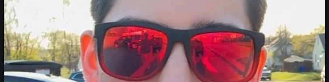A person wearing red sunglasses takes a selfie outdoors. Text reads: "I want someone who knows the difference between poisonous and venomous."