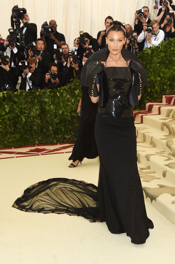 Bella in a sleek gown with a long train