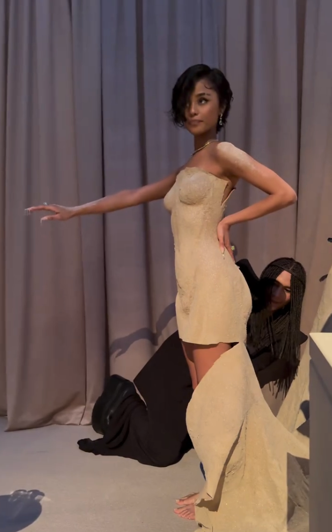 Tyla poses as Olivier cuts her gown into a minidress
