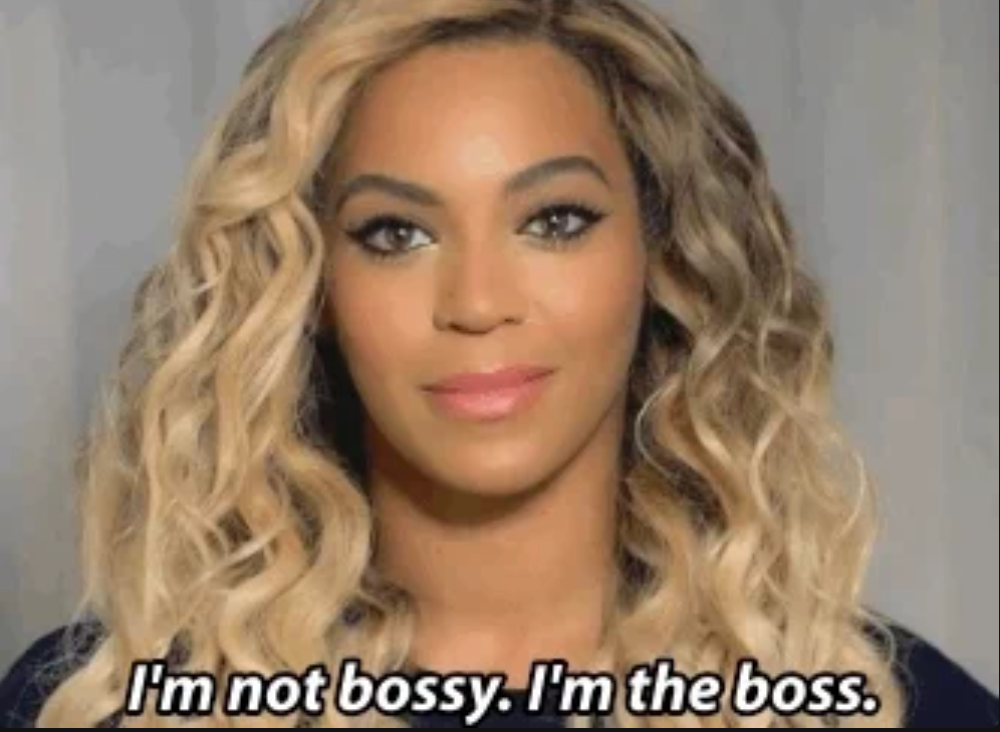 Person with blonde curly hair, text: "I'm not bossy. I'm the boss."