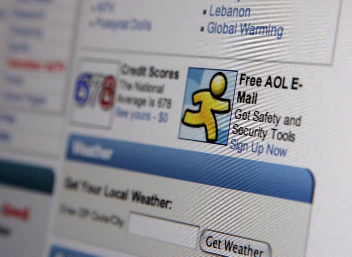Close-up of a webpage showing a free AOL email ad and local weather information. The page mentions credit scores and security tools
