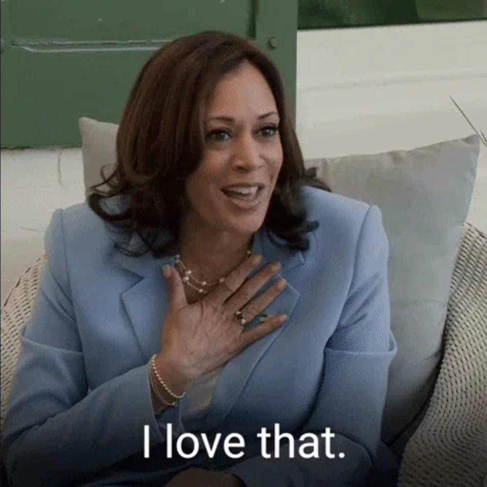 A woman in a suit smiles and gestures with her hand on her chest, conveying admiration. The text reads, "I love that."