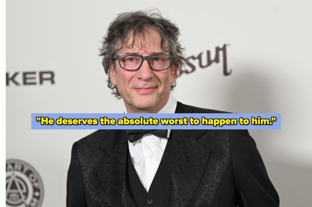 Person in a tuxedo with a bow tie, wearing glasses, posing at a formal event