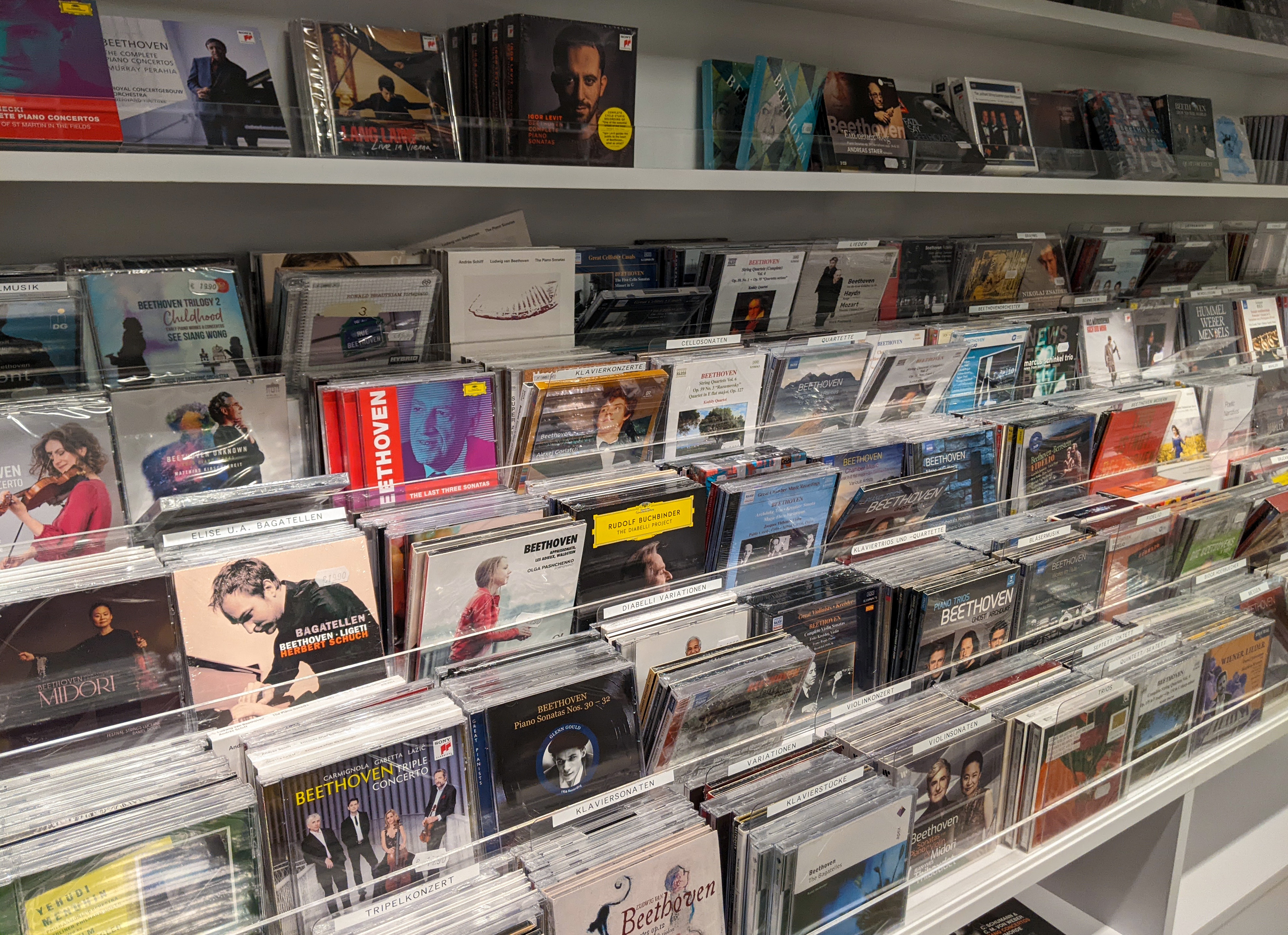 Store display featuring shelves of classical music CDs in a variety of cases and cover art