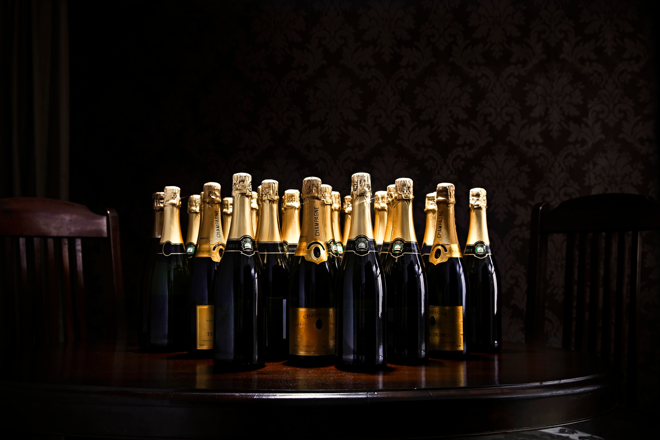 Several champagne bottles are arranged on a table