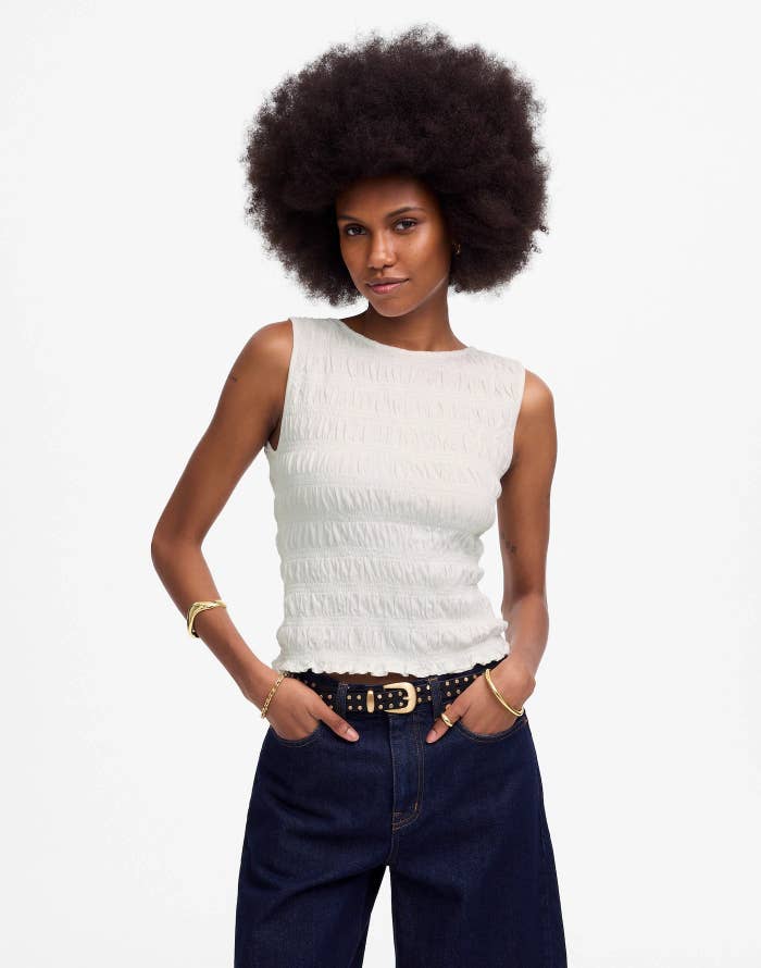 Model wearing a sleeveless textured top