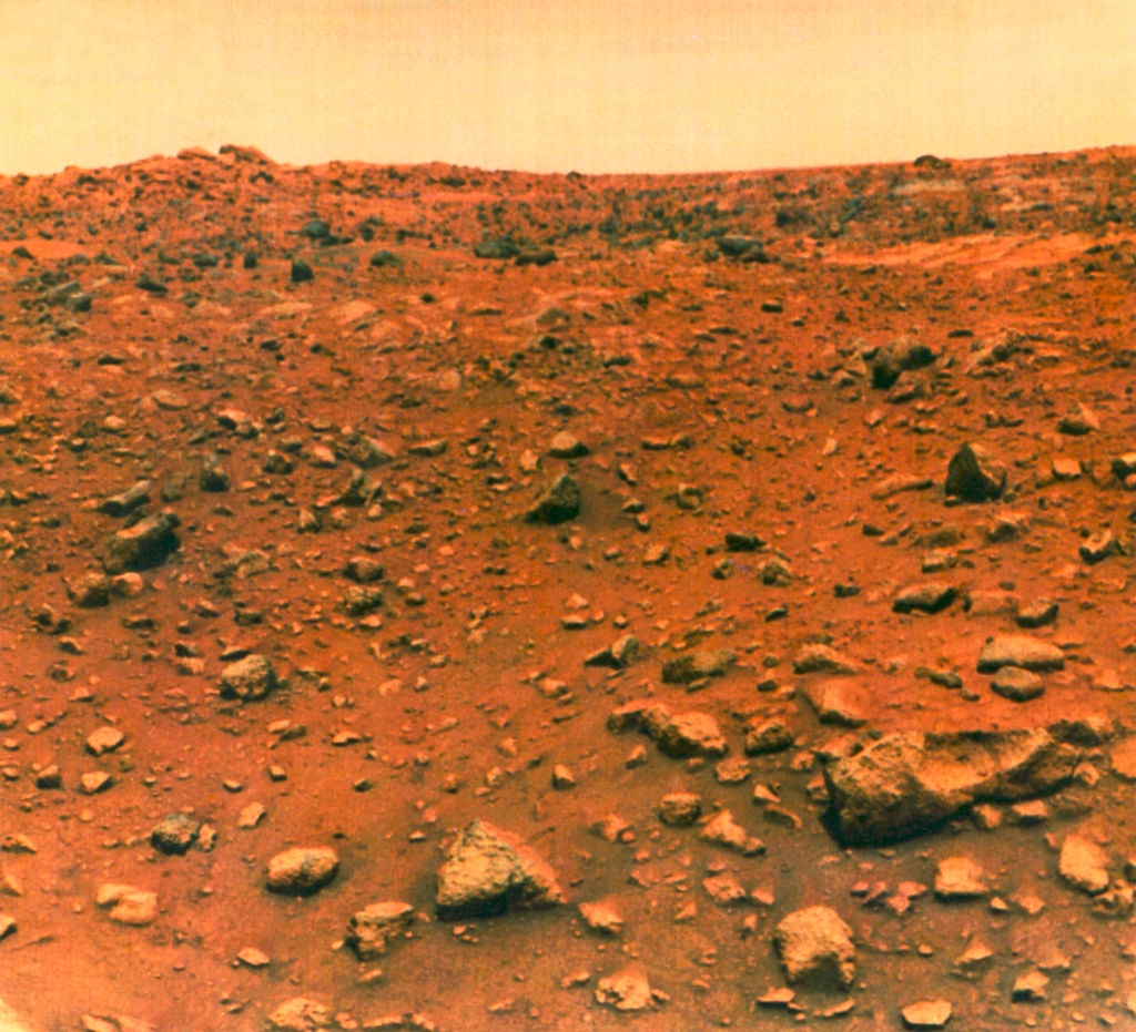 Rocky landscape of Mars with scattered boulders and a distant horizon