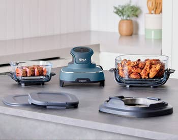Ninja CRISPi cooking strategy connected countertop with containers of crispy food, lids, and PowerPod unit. Ideal for tiny and ample batch cooking