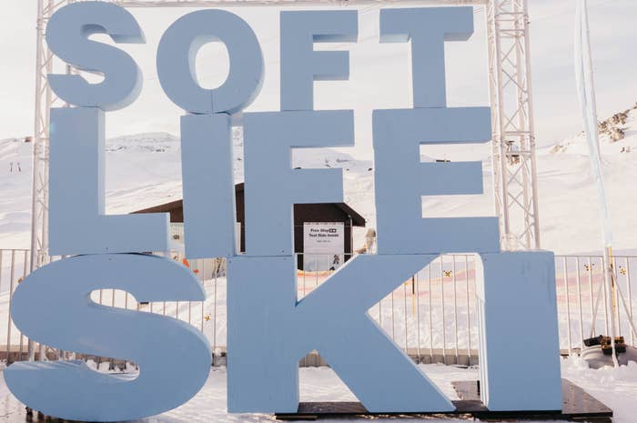 Large 3D letters spelling "Soft Life Ski" stand outdoors in a snowy landscape