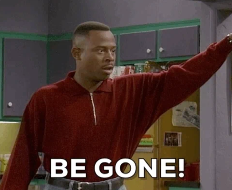 Person gesturing with an outstretched arm in a kitchen. White text at the bottom says "BE GONE!"