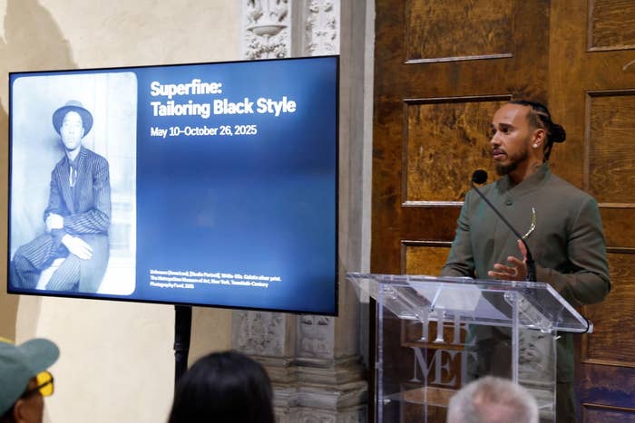 Speaker at a podium next to a display about 