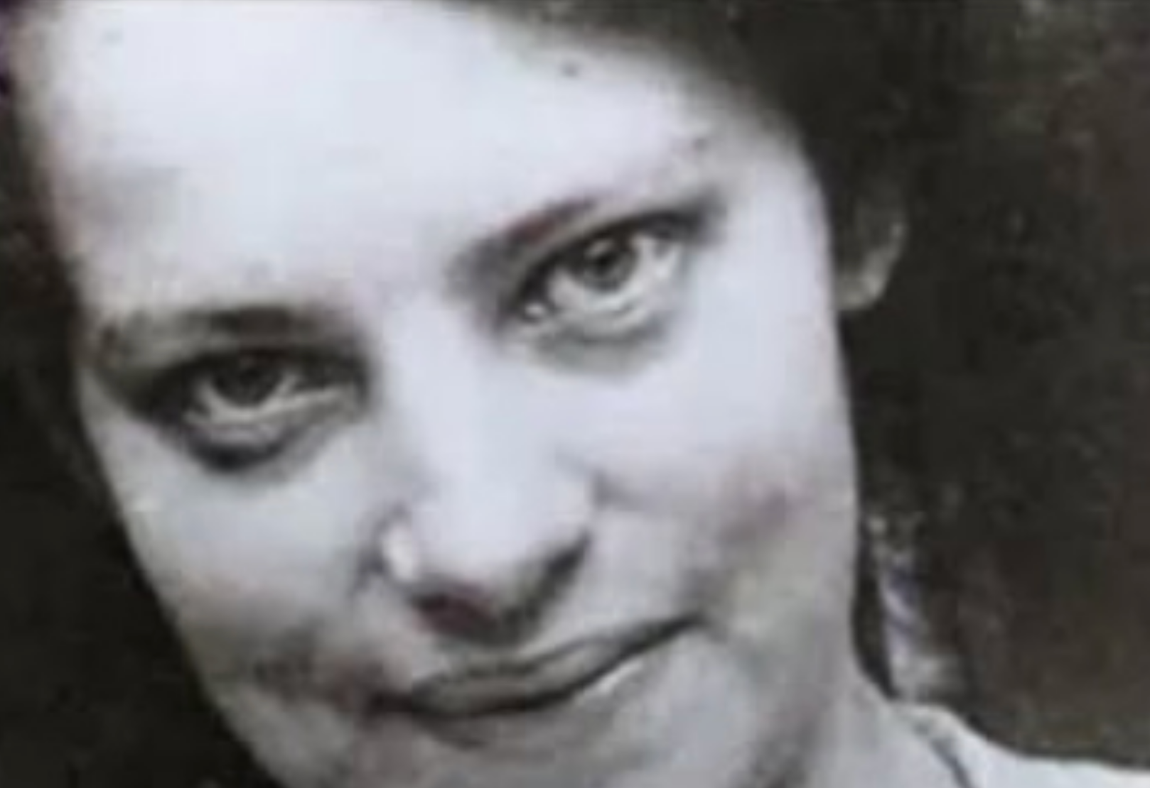 I don't know who this person is, but it's a close-up black and white photo of a woman with wavy hair and a slight smile