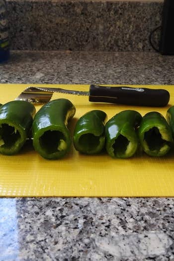 Jalapeños with tops removed and insides hollowed out