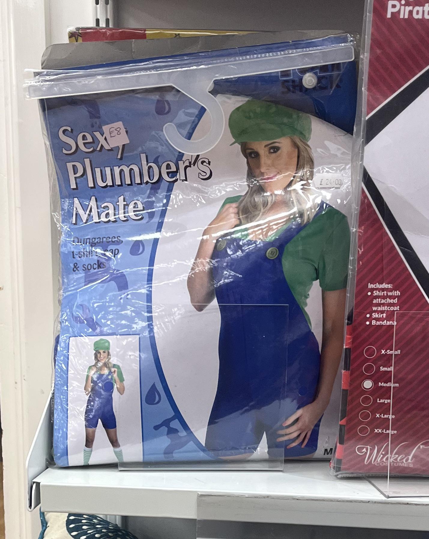 Costume package labeled "Sexy Plumber's Mate" includes a jumpsuit, shirt, cap, and socks, featuring a model in a plumber-style outfit