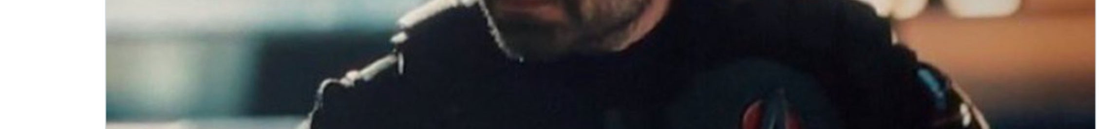 Man dressed as superhero with long hair in a dark setting, wearing a costume with a metallic arm. Tweet suggests surprise about a potential movie cameo