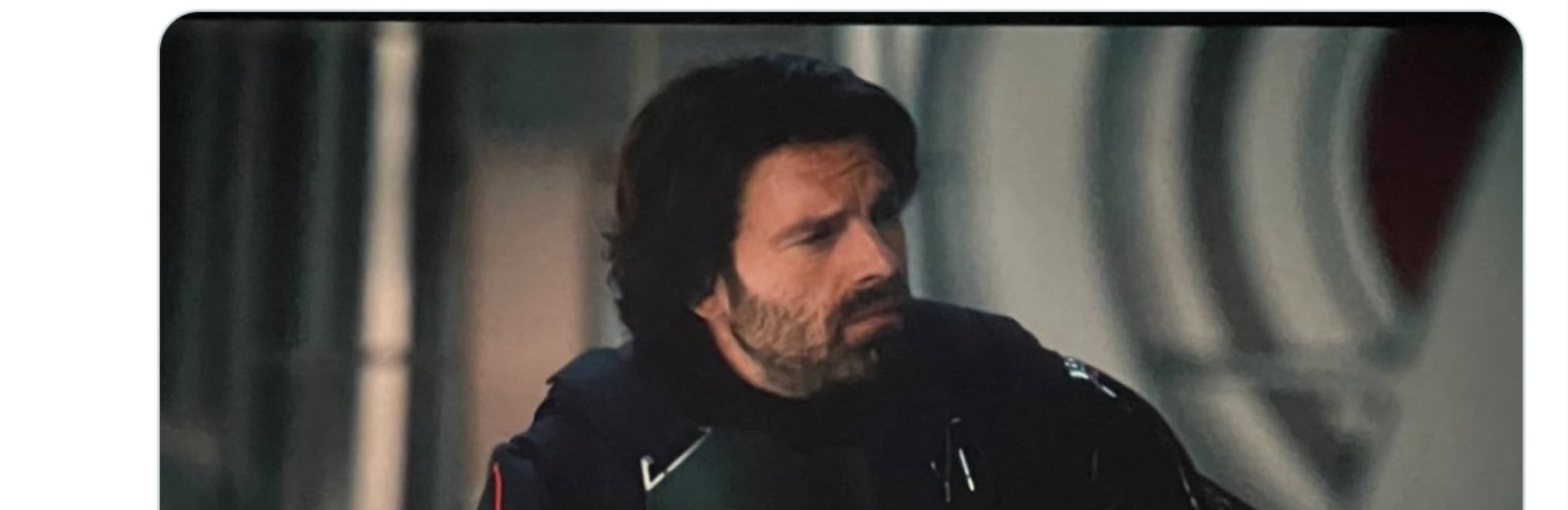 Tweet discusses excitement about a post-credit scene featuring a character named Bucky, who is pictured in a serious pose wearing a dark superhero suit