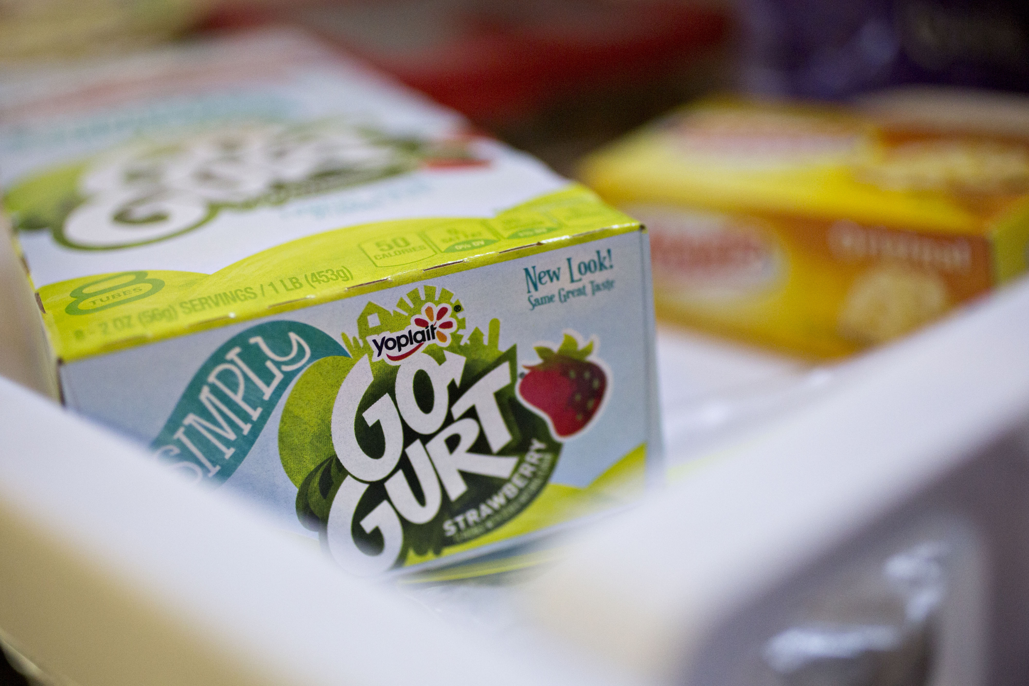 A close-up of a Yoplait Simply Go-Gurt box with strawberry flavor prominently displayed