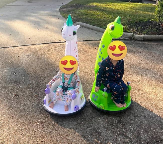 children sitting successful a dinosaur and unicorn-themed bumper car retired connected the thoroughfare