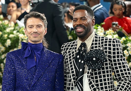 Raúl has a silky neckscarf, and Colman has a large floral brooch