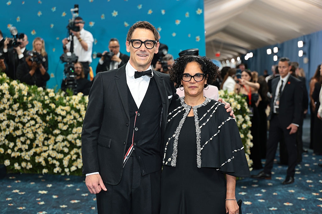 close up of the couple, both wearing glasses