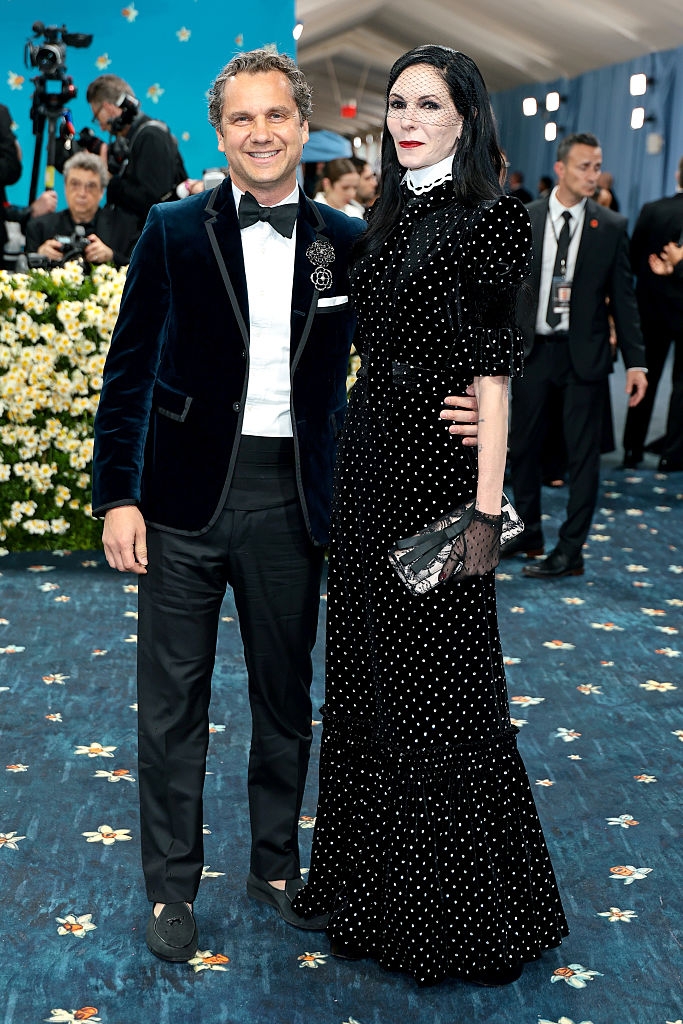 Harry in a tuxedo and Jill in a polka-dot gown with lace gloves