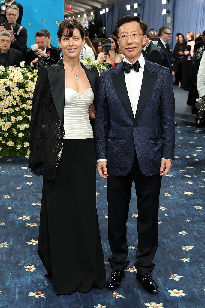 Iris in a strapless gown and lace shawl, Yan Huo in a patterned tuxedo