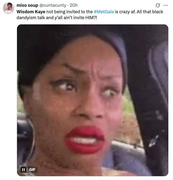 A concerned woman with a surprised expression is captured in a meme. The caption questions why Wisdom Kaye wasn&#x27;t invited to the Met Gala