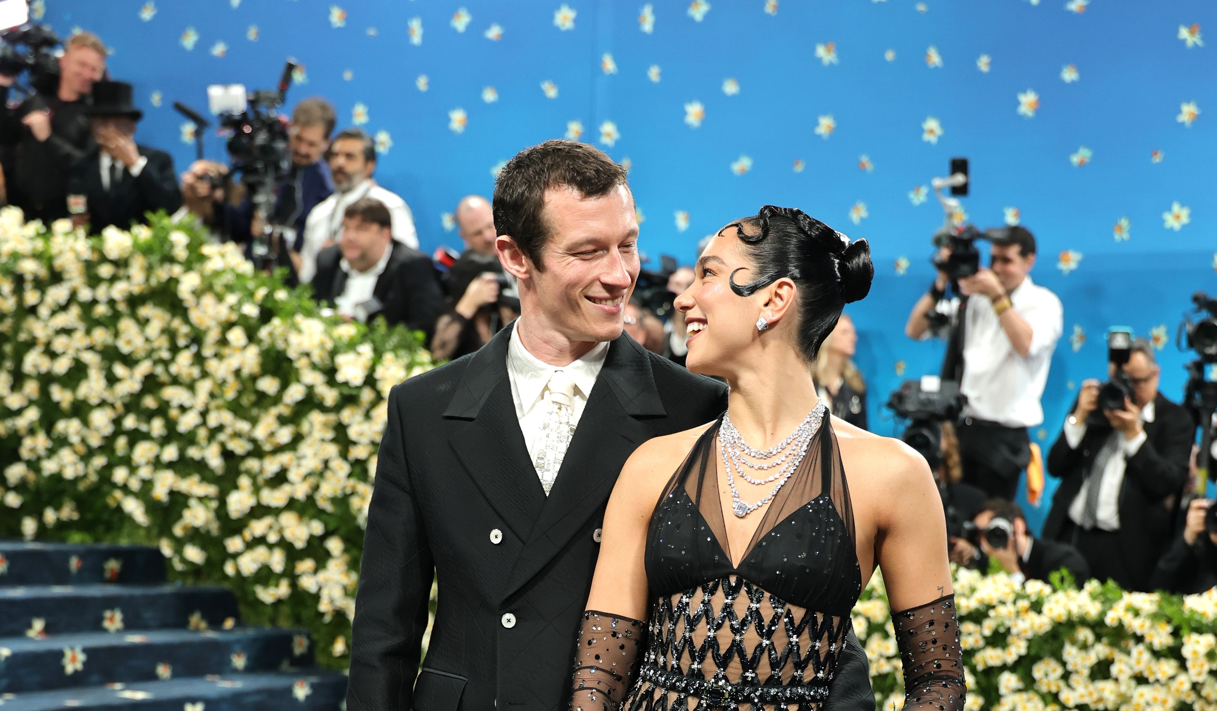 Callum and Dua looking into each other's eyes