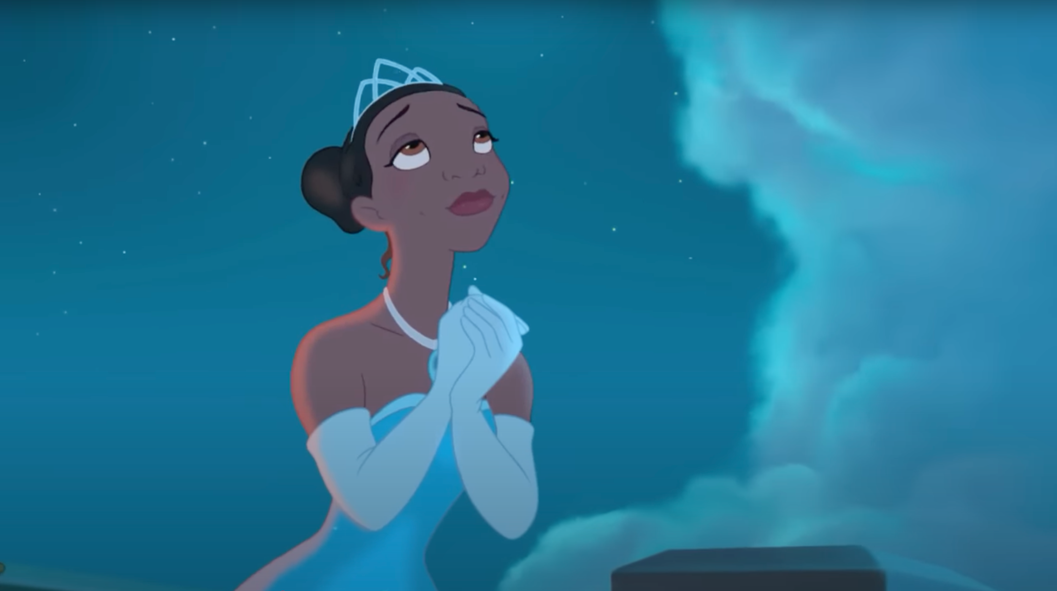 Tiana stares into the night sky, clasping her hands and wearing a crown, in "The Princess and the Frog"