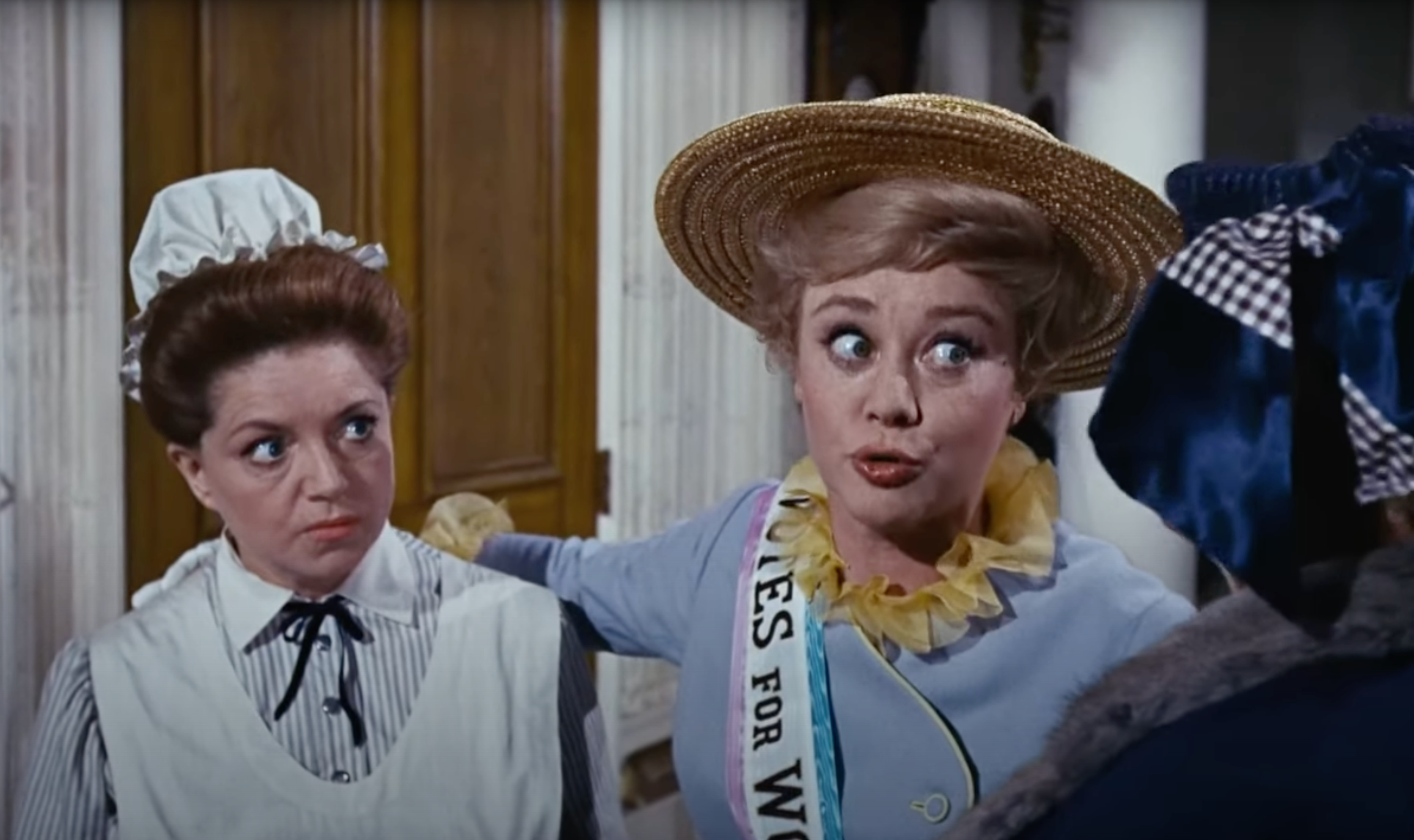 Winifred Banks (played by Glynis Johns) wearing a sash that reads "Votes for Women" in "Mary Poppins"