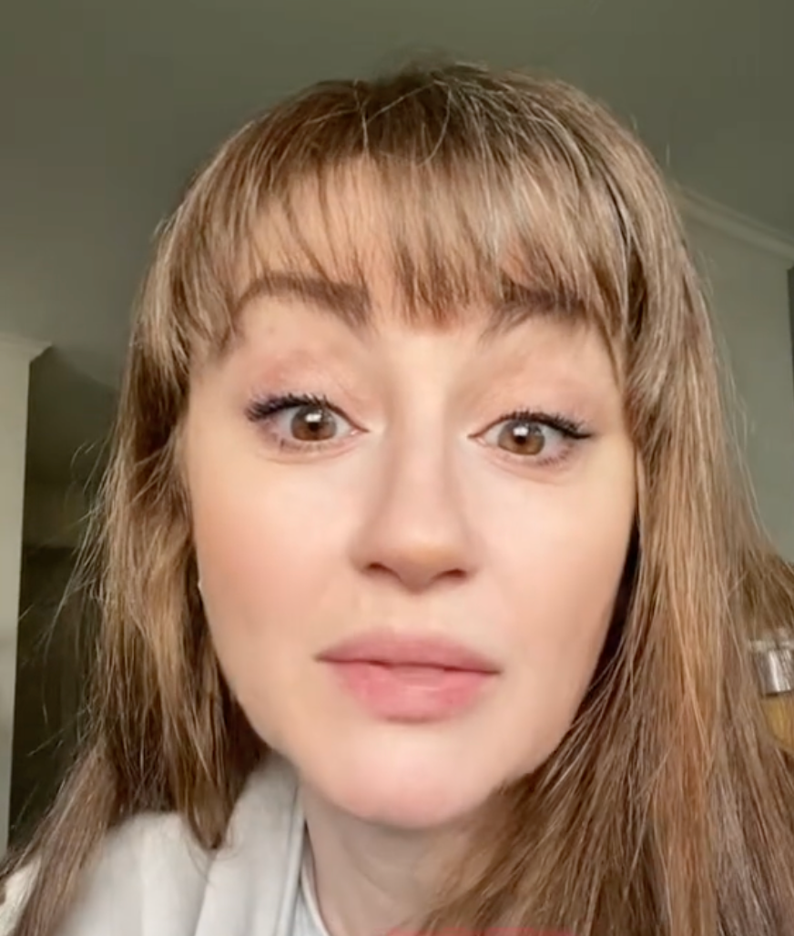 Person with long hair and bangs looking at the camera with text overlay "RIGHT THERE" at the bottom