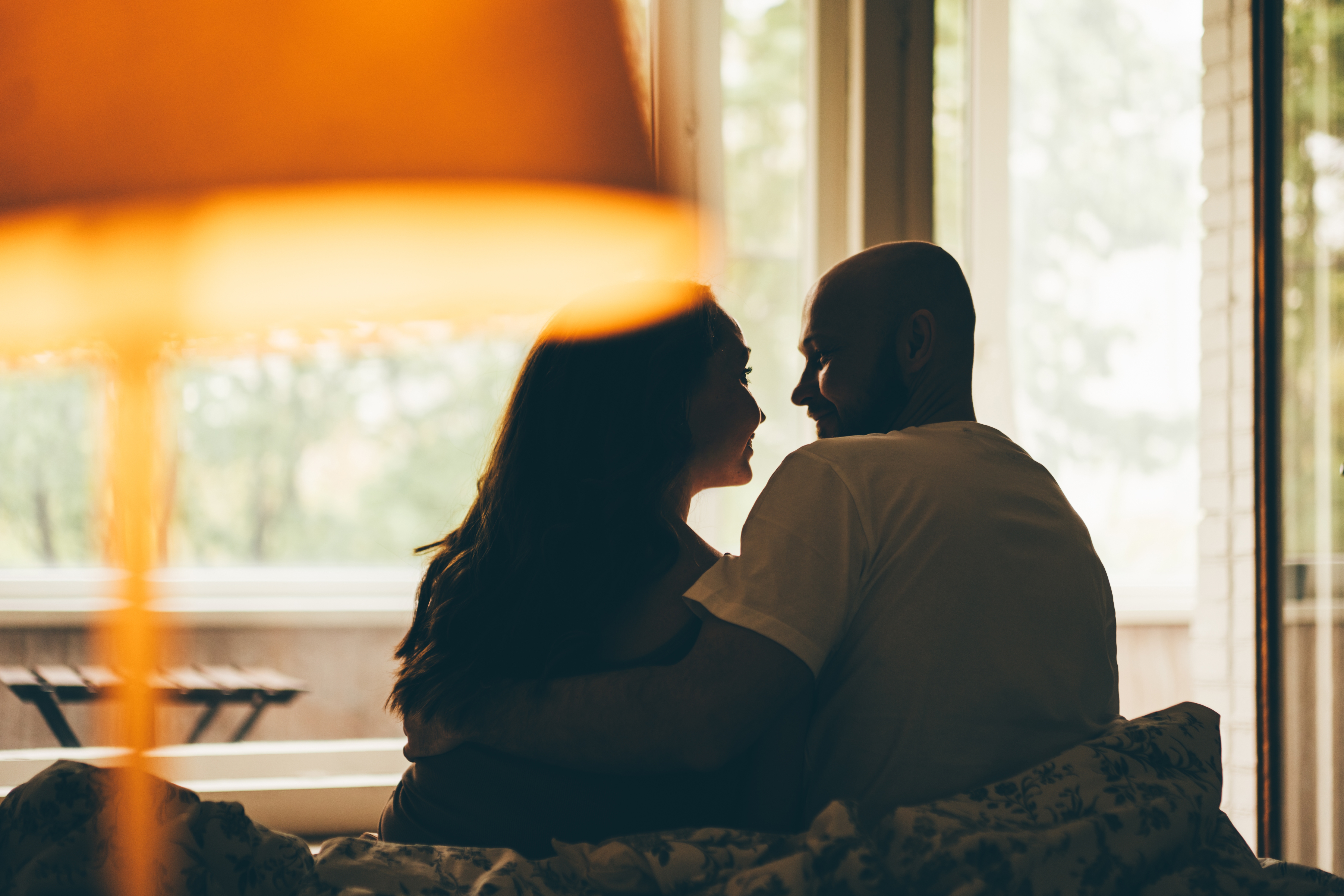 Silhouette of a couple sitting together.