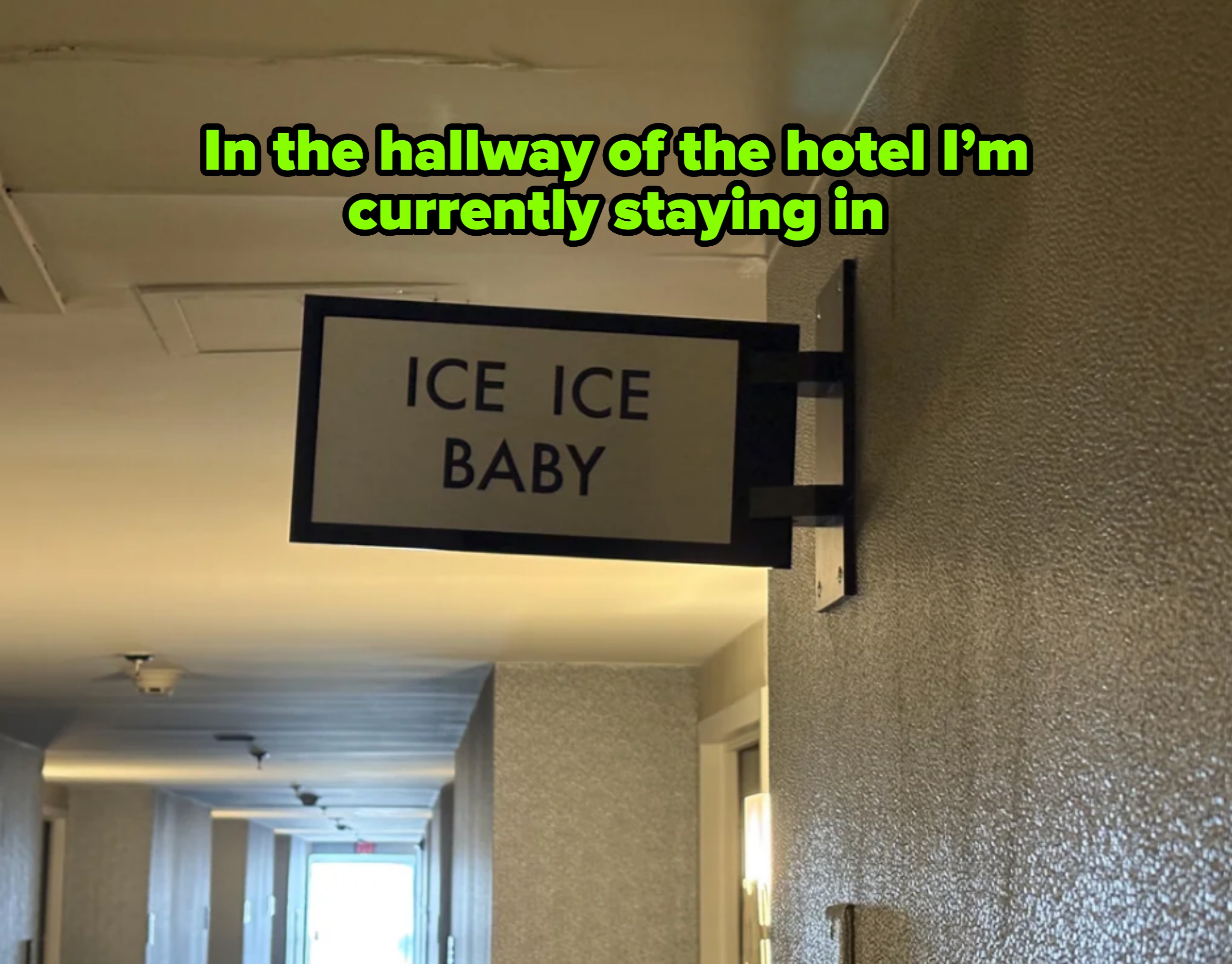 Sign for ice in hotel hallway reads "ICE ICE BABY"