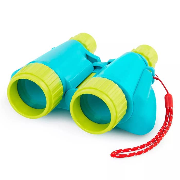 Toy binoculars with a reddish  drawstring  attached, featuring a playful plan  suitable for children