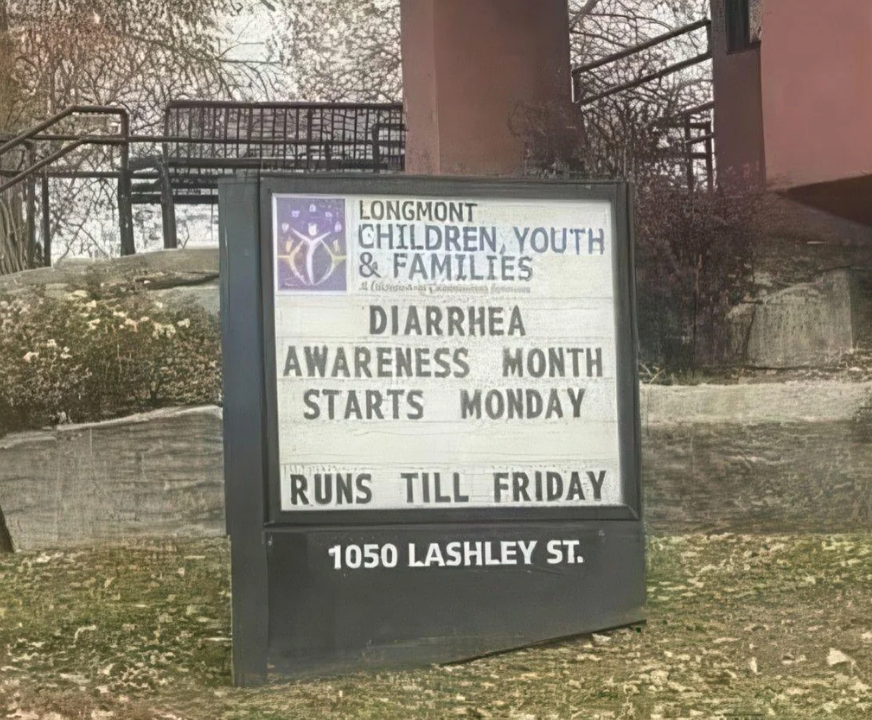 Sign reads: "Longmont Children, Youth & Families. Diarrhea Awareness Month starts Monday, runs till Friday. 1050 Lashley St"