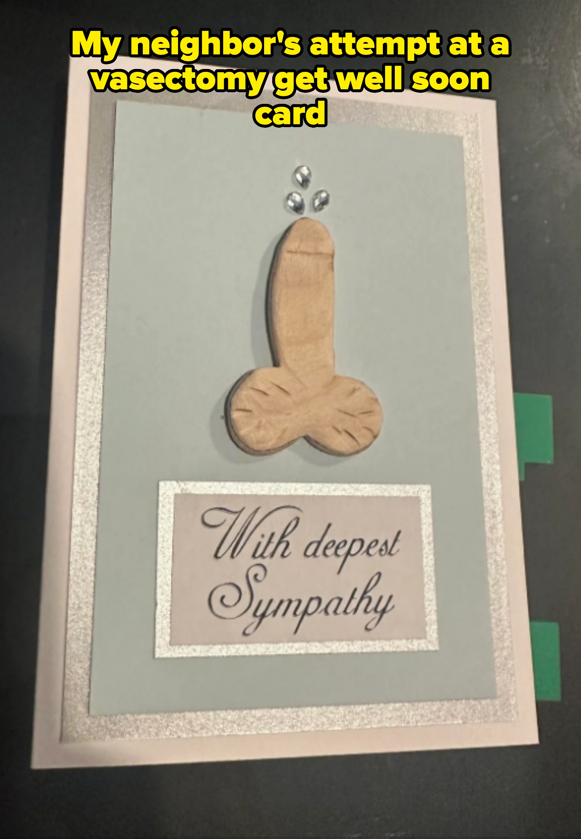 Sympathy card with a humorous wooden decoration resembling male genitalia at the top. Text on card reads, "With deepest Sympathy." Caption: "My neighbor's attempt at a vasectomy get well soon card"