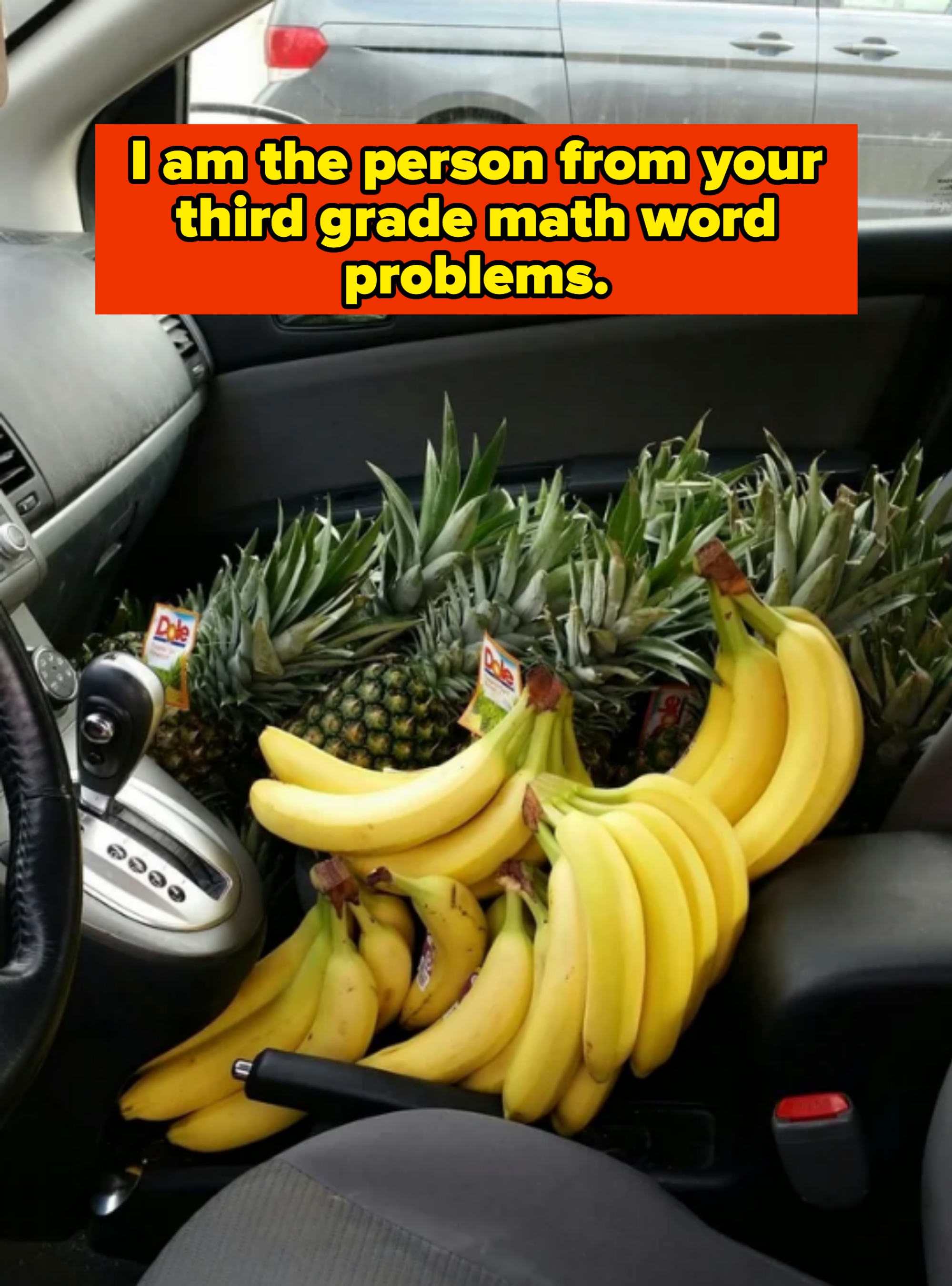 Car interior filled with bunches of bananas and pineapples on the passenger seat, captioned, "I am the person from your third grade math word problems"
