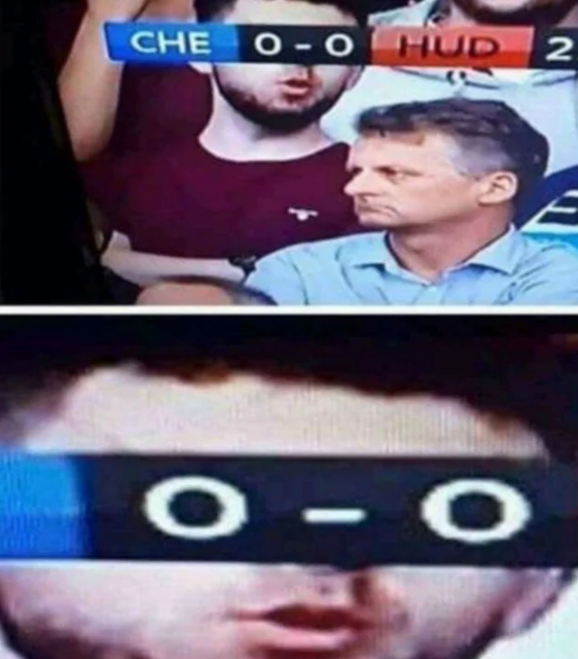 Game scoreboard shows 0-0. A fan's eyes humorously align with scoreboard numbers