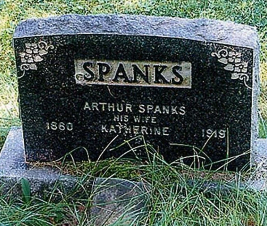 Headstone engraved with "Spanks," marking the graves of Arthur Spanks and his wife Katherine. Headstone appears to read "Arthur spanks his wife Katherine"