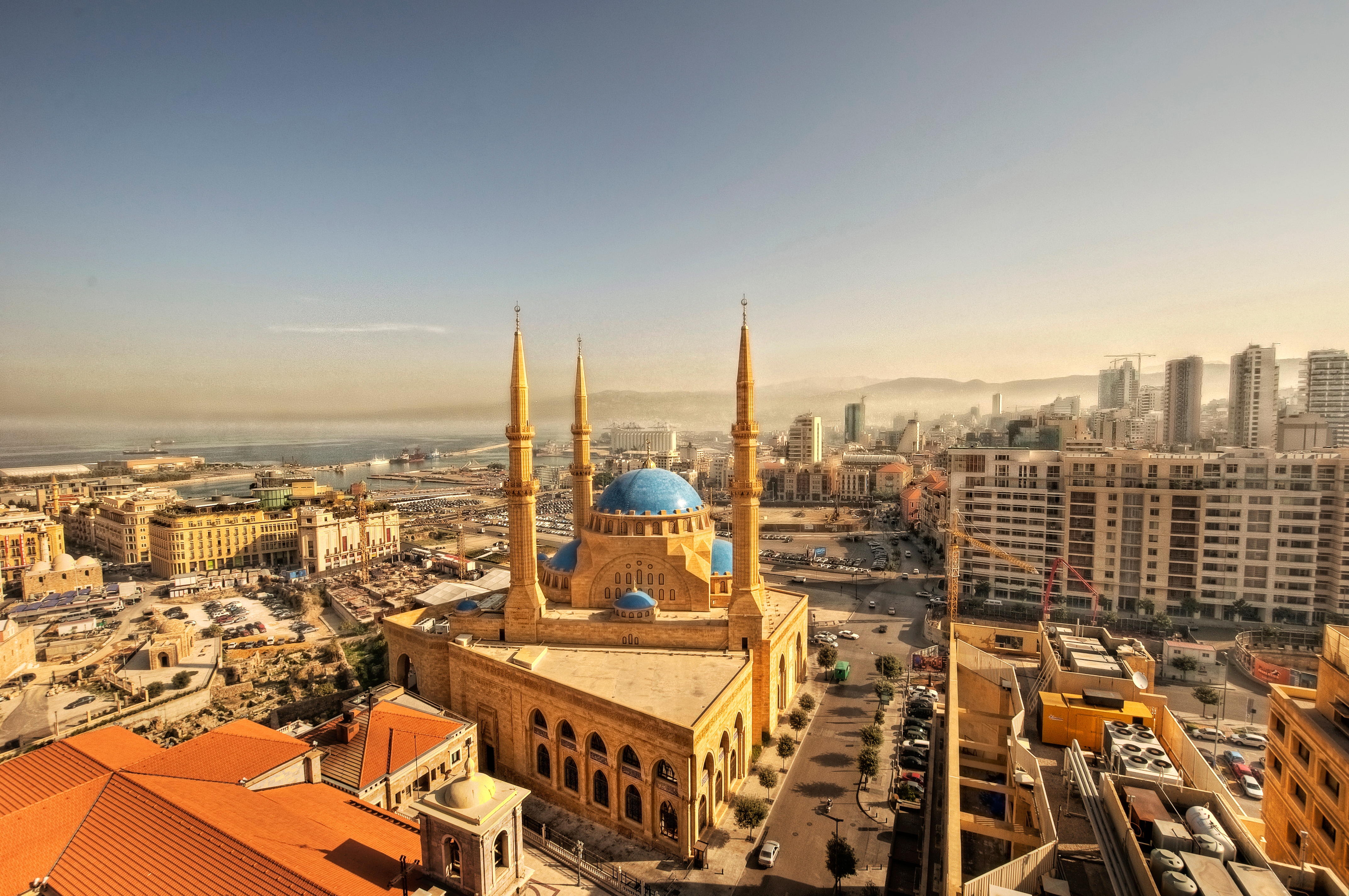 Skyline view of Beirut with the Mohammad Al-Amin Mosque and high-rise buildings under a clear sky