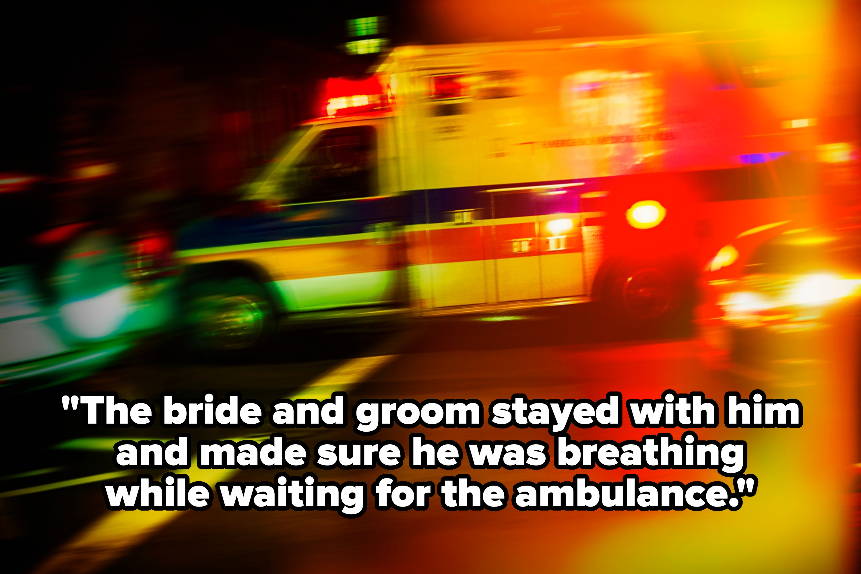 Blurred image of an ambulance with flashing lights on a street at night