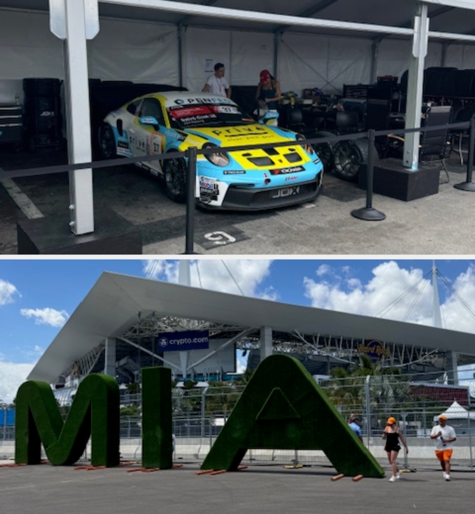 Race car in a tent with equipment; outdoor view of large "MIA" letters at a motorsport event entrance