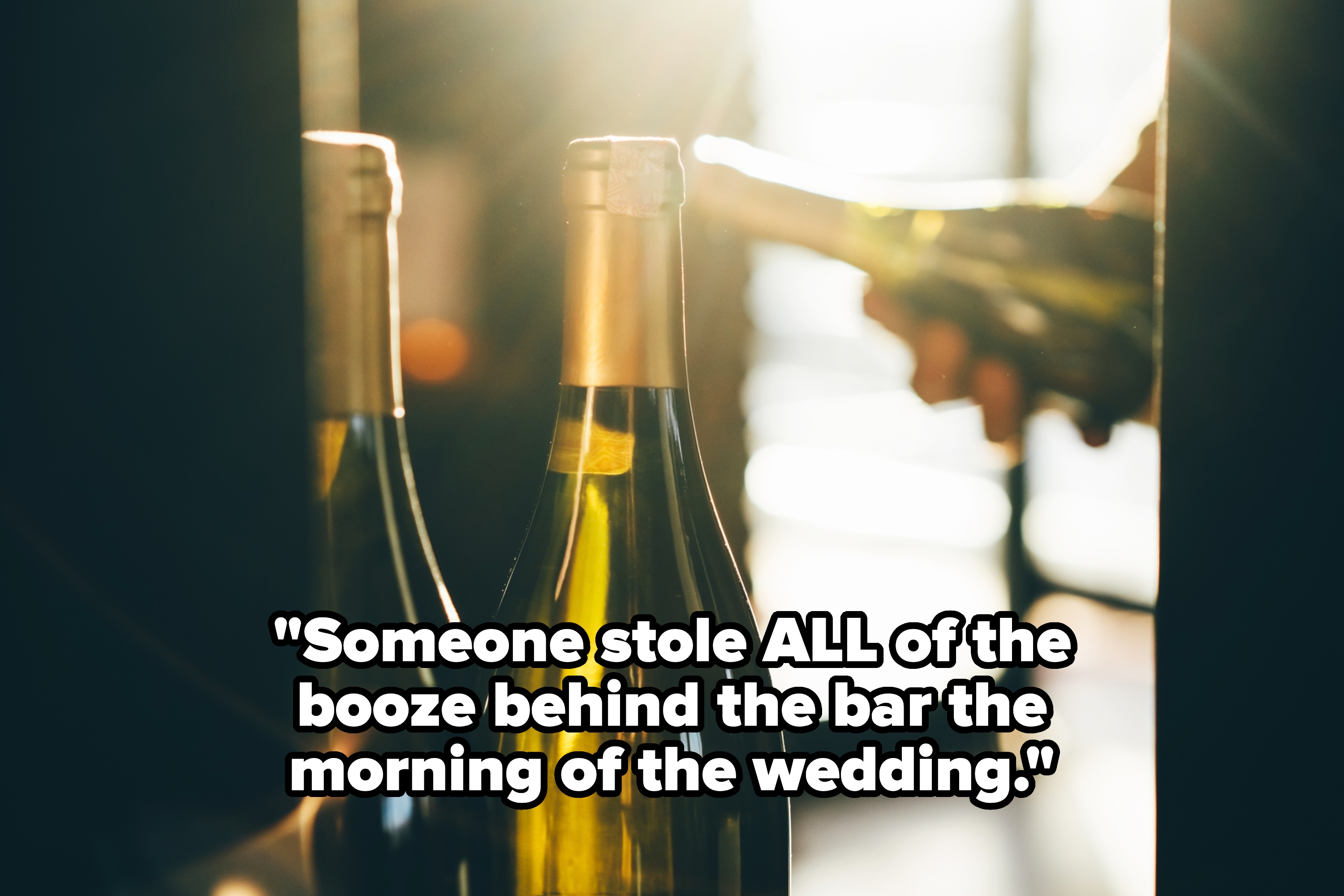 Wine bottles in soft focus with warm lighting, suggesting a celebratory or wedding event setting