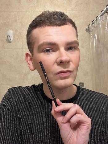 BuzzFeed writer Daniel Boan wearing brow wiz pencil