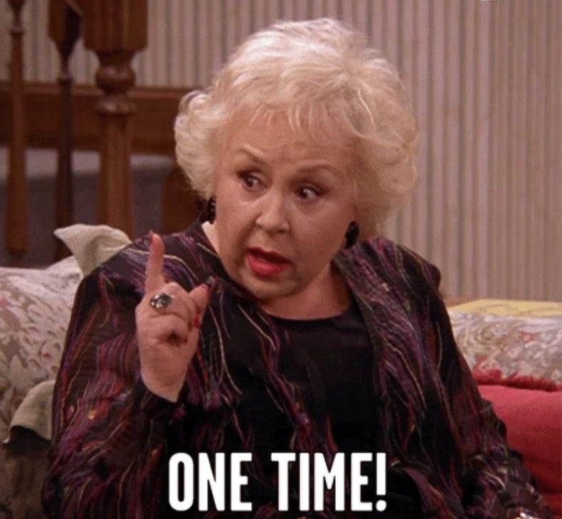 Person with expressive gesture points finger, captioned with "ONE TIME!" suggesting emphasis or importance