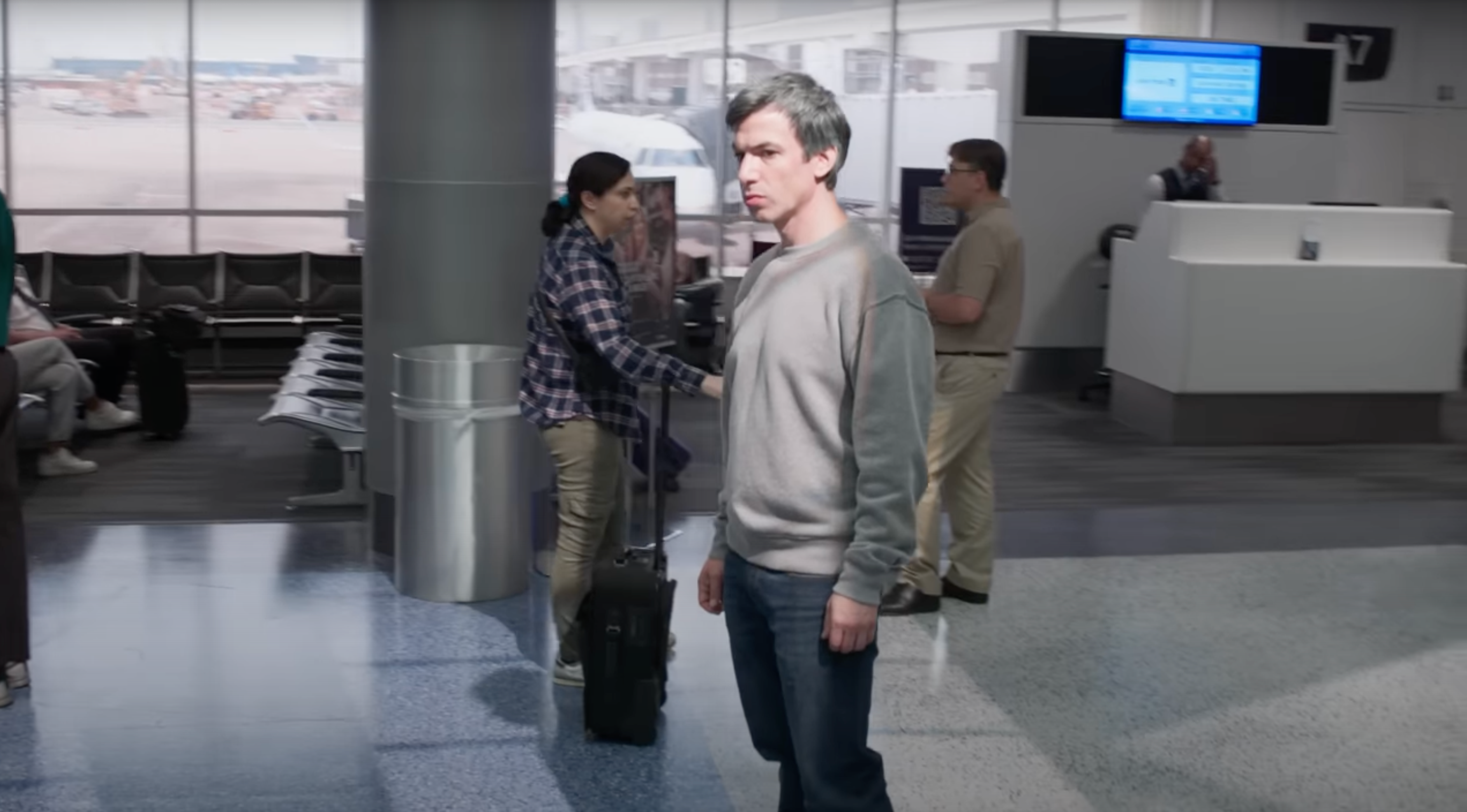 Nathan Fielder stands in the middle of an airport during a scene from "The Rehearsal"